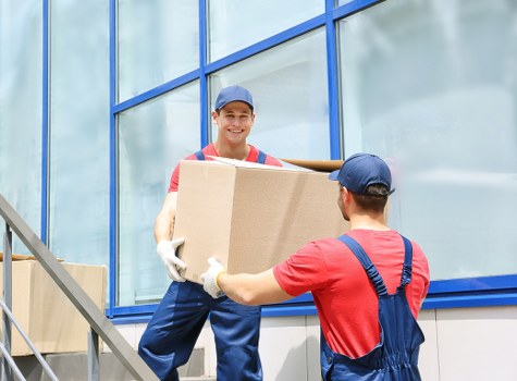 Man and Van truck loaded with moving boxes and furniture in Sutton