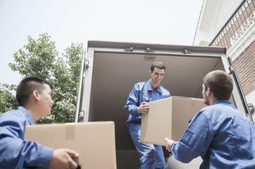 Experienced movers organizing items for relocation