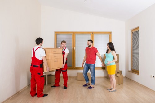 Professional house removalists assisting with packing in Sutton