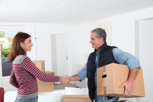 Experienced removalists carefully handling furniture